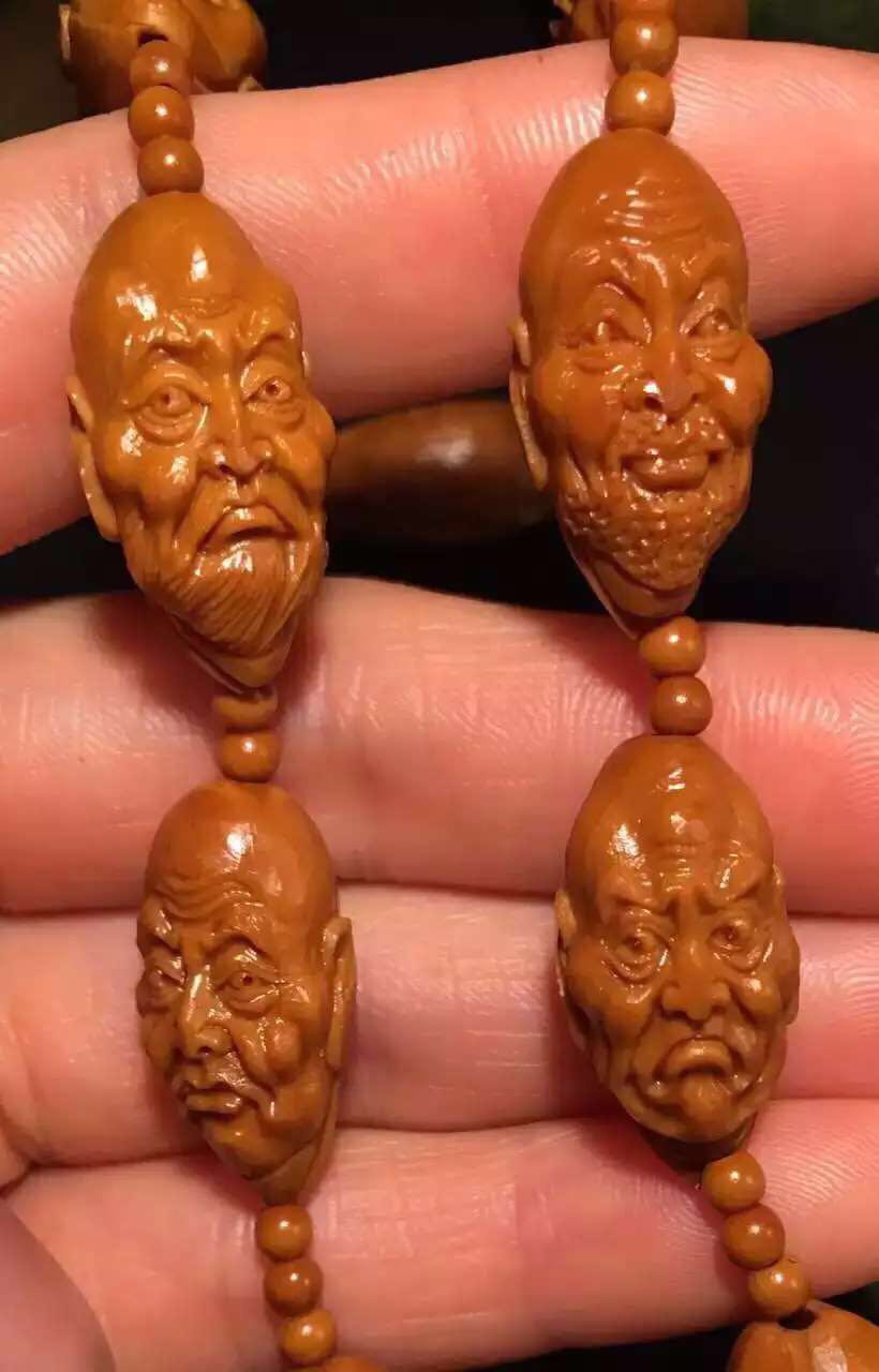 文玩橄榄核雕刻手串出售,橄榄核雕刻的文玩怎么盘好看