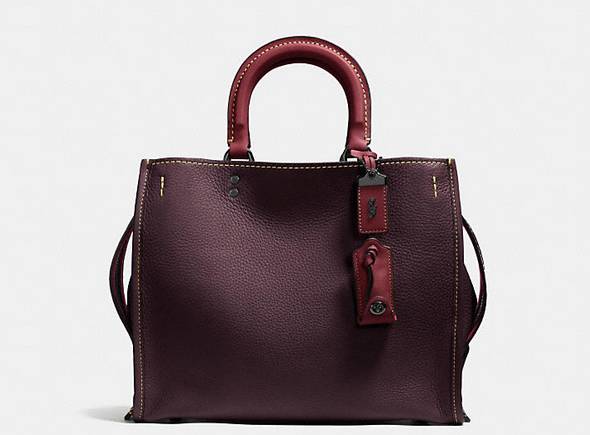 coach一款圆柱形的包,大logo的coach包