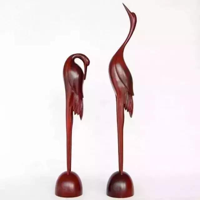 木雕兽头什么寓意,长颈鹿木雕婚礼摆件有什么寓意