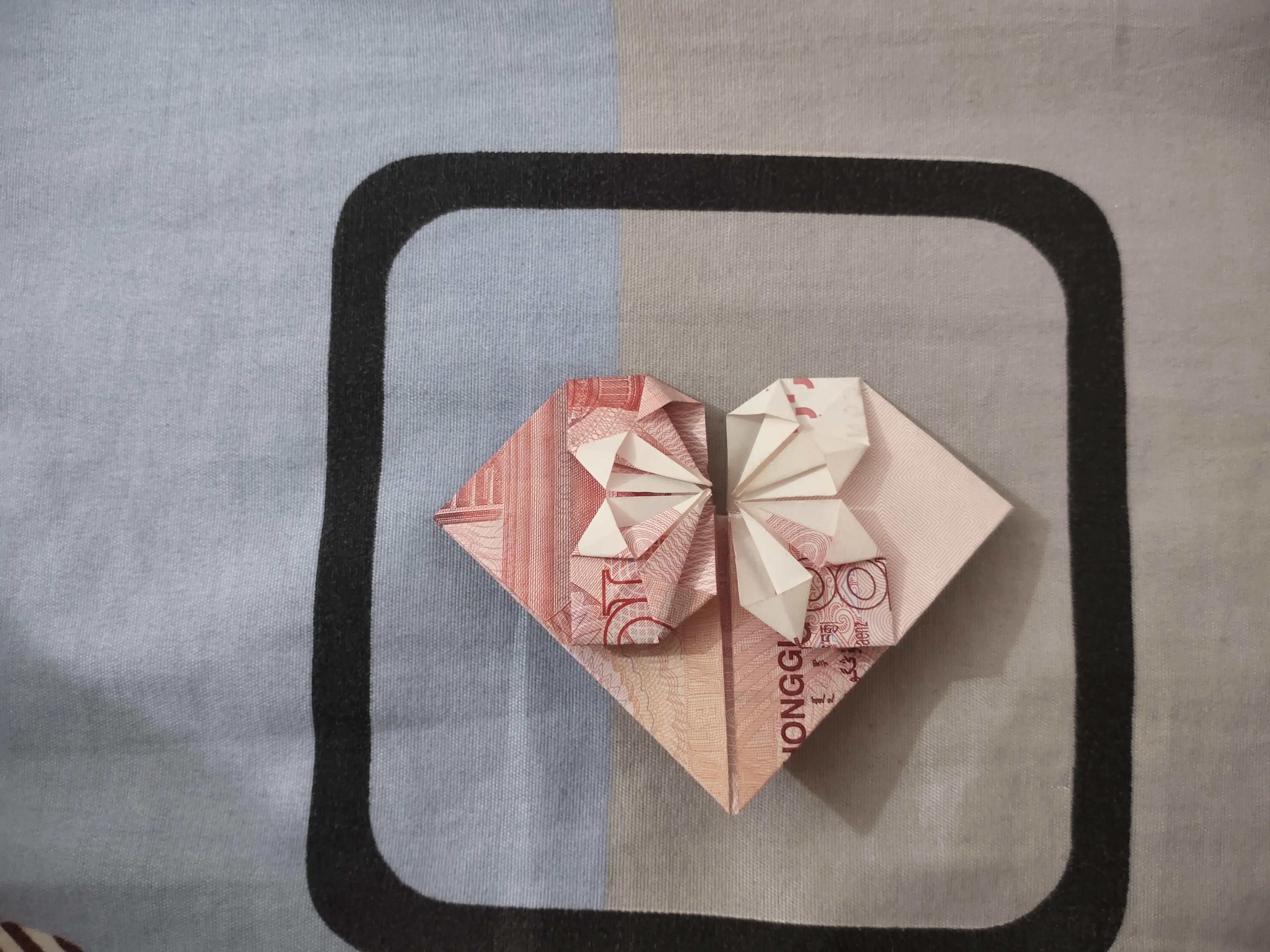 一百块钱折双爱心步骤,折爱心步骤